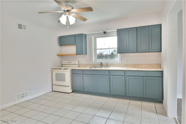 kitchen with ceiling fan, light tile patterned floors, white range with electric cooktop, sink, and blue cabinets