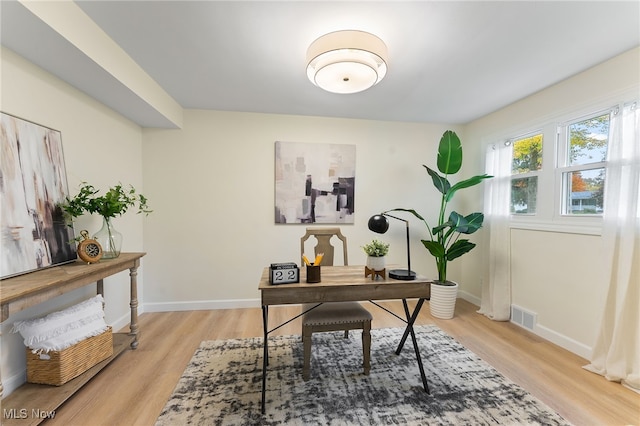 home office featuring light hardwood / wood-style floors