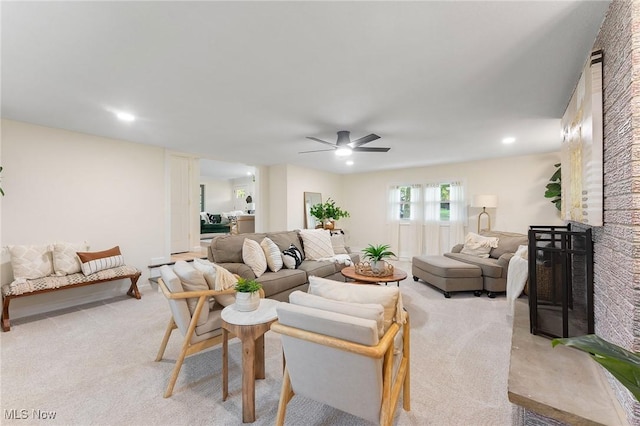 living room featuring ceiling fan and light carpet