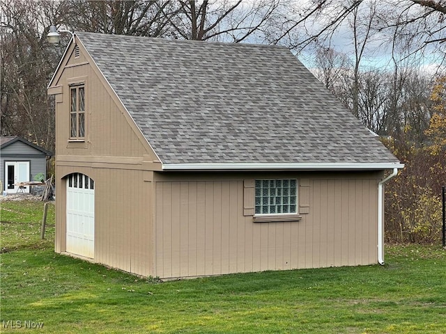 view of outbuilding featuring a lawn