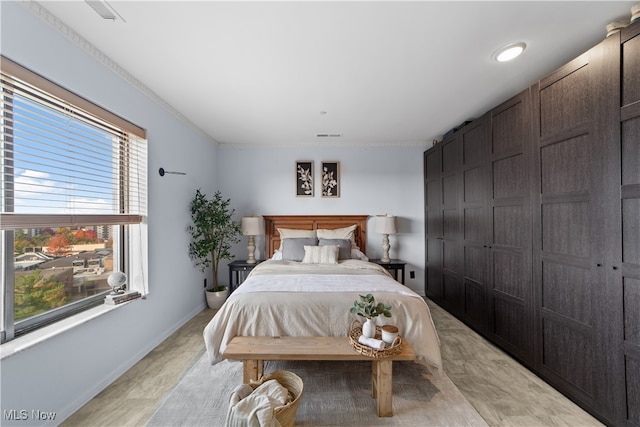 bedroom featuring crown molding