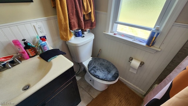 bathroom with vanity, toilet, and tile patterned flooring