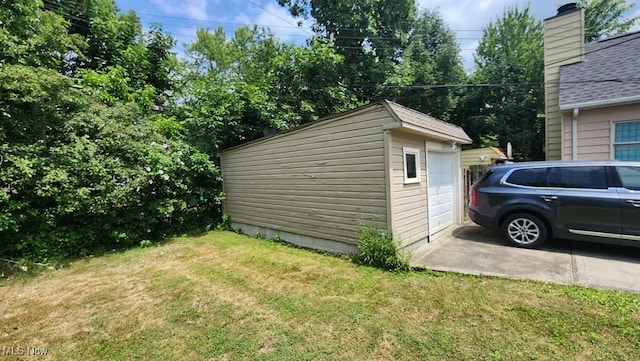 view of outdoor structure featuring a lawn