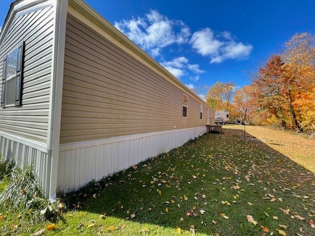 view of property exterior featuring a yard