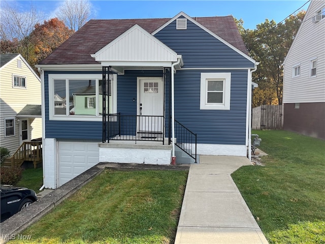 view of front of house with a front lawn and a garage