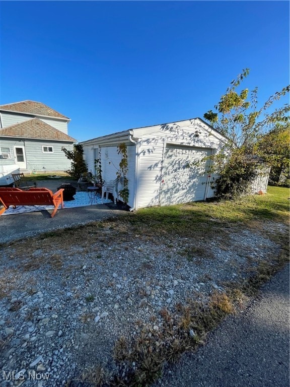 view of side of property featuring a garage