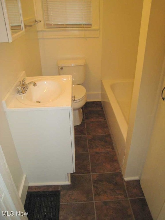 full bathroom with vanity, toilet, tile patterned floors, and separate shower and tub