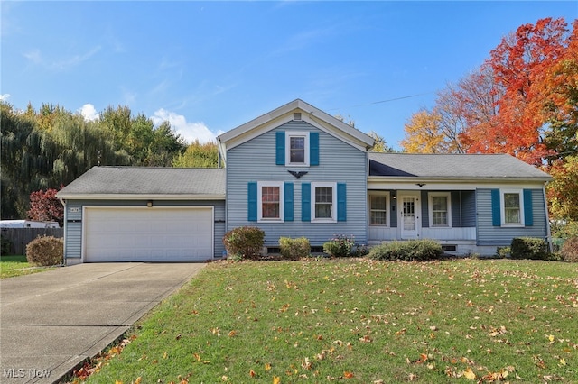 view of front of property with a front yard, a garage, and covered porch