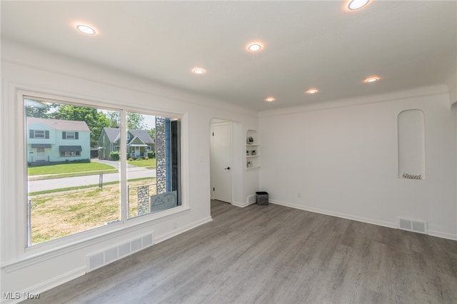 spare room with hardwood / wood-style flooring