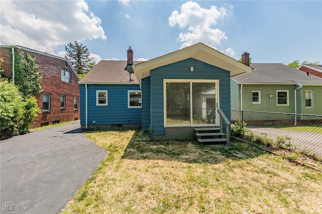 bungalow with a front yard