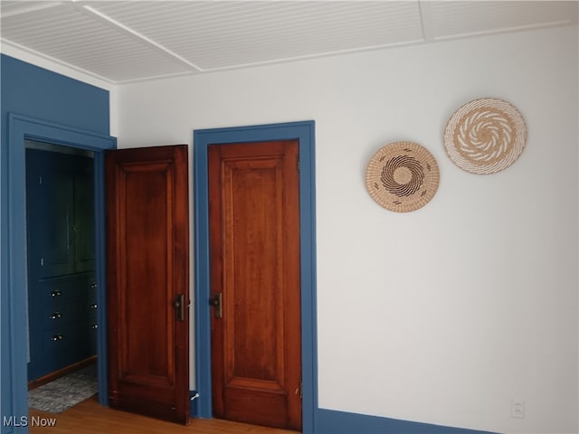 unfurnished bedroom with wood-type flooring