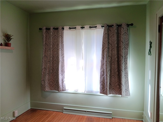 empty room featuring hardwood / wood-style floors