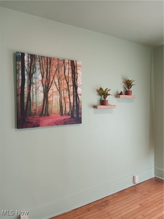 empty room with hardwood / wood-style floors