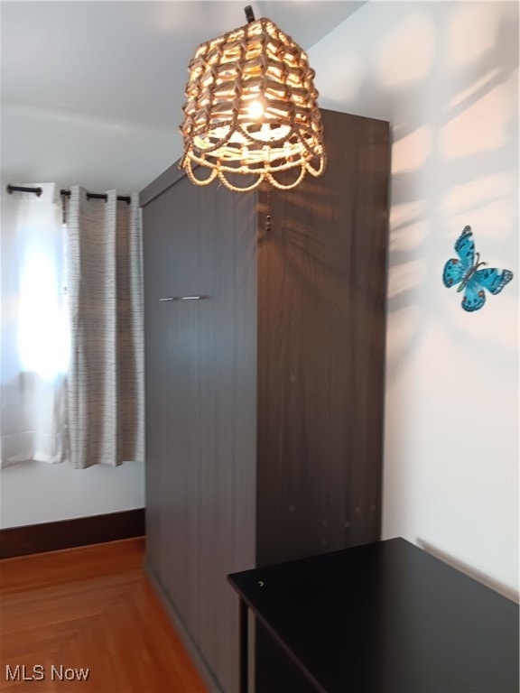 unfurnished dining area featuring hardwood / wood-style floors