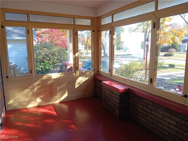 sunroom / solarium featuring a healthy amount of sunlight