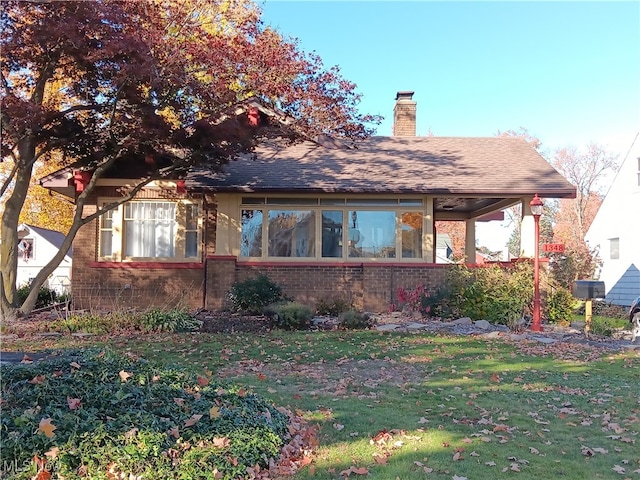 exterior space featuring a front lawn