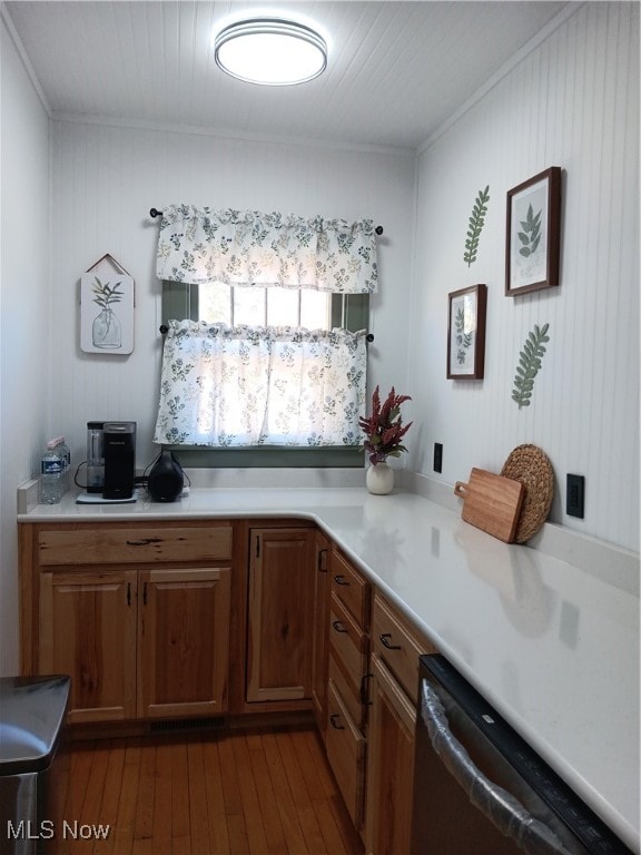 kitchen featuring wood-type flooring and stainless steel dishwasher