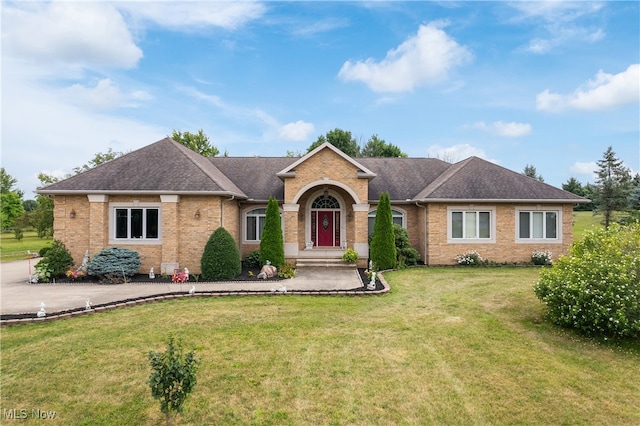 ranch-style home with a front lawn