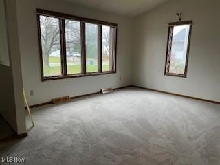 unfurnished room with carpet flooring and lofted ceiling