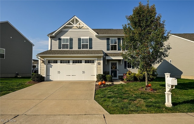 view of front of house with a front lawn and a garage