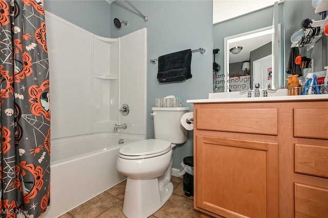 full bathroom featuring vanity, toilet, tile patterned floors, and shower / tub combo