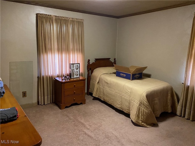 carpeted bedroom with crown molding