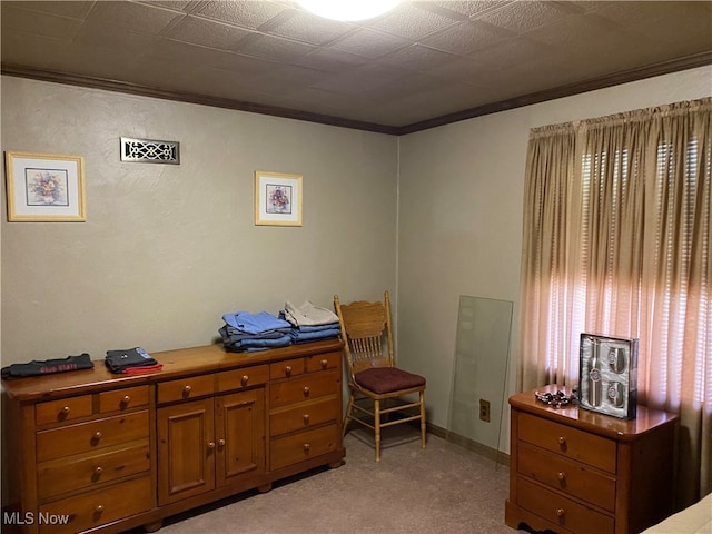 bedroom with light carpet and ornamental molding