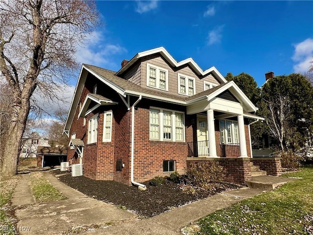 view of front of house featuring cooling unit and covered porch