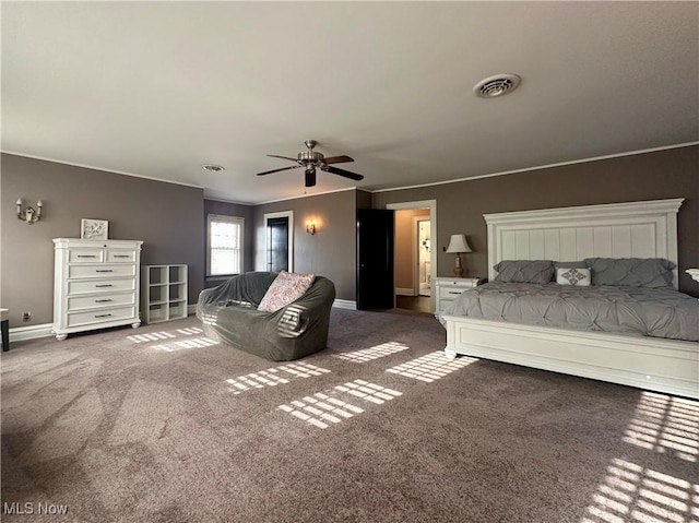 unfurnished bedroom with dark colored carpet and ceiling fan