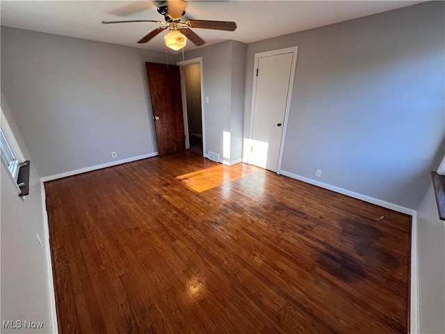 unfurnished bedroom featuring hardwood / wood-style floors and ceiling fan