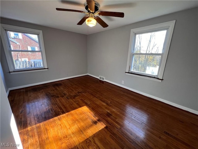 unfurnished room featuring hardwood / wood-style flooring and ceiling fan