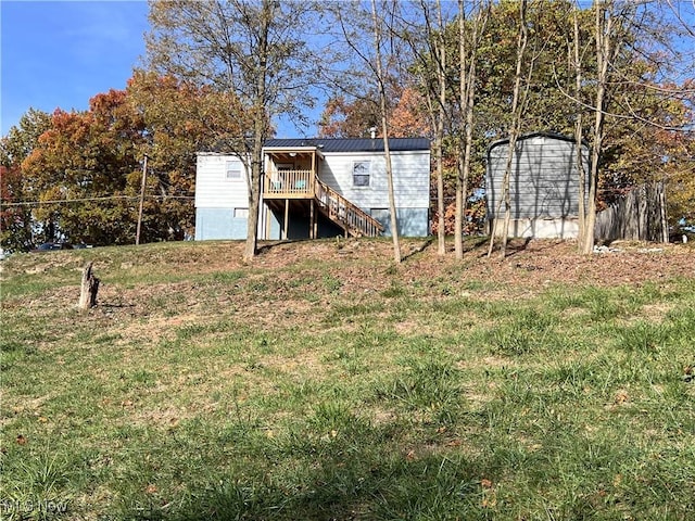 view of yard with a wooden deck