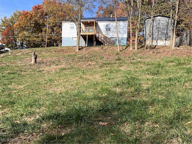 view of yard with a wooden deck