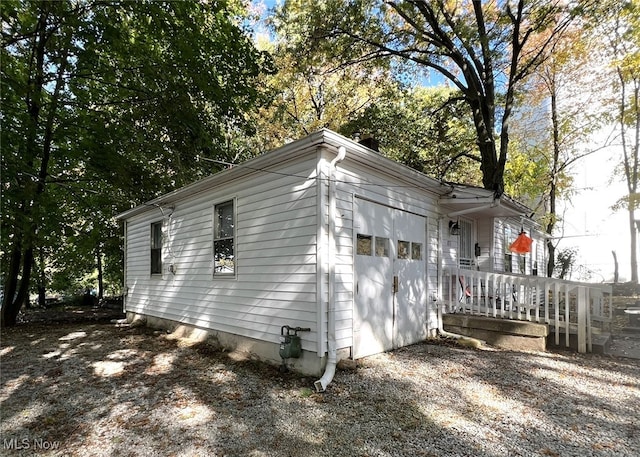 view of property exterior featuring a deck