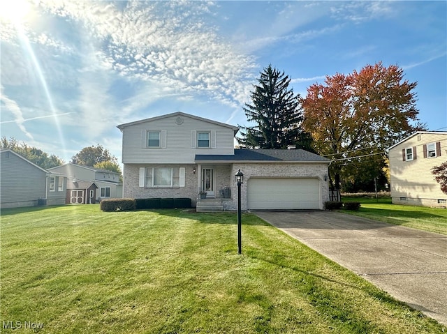 view of front property with a front lawn and a garage