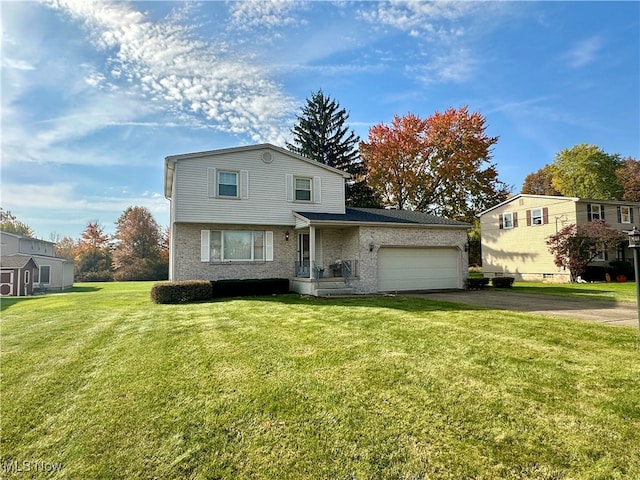 view of property with a front lawn and a garage