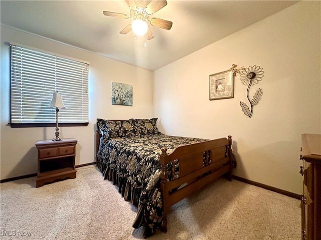 bedroom with light colored carpet and ceiling fan