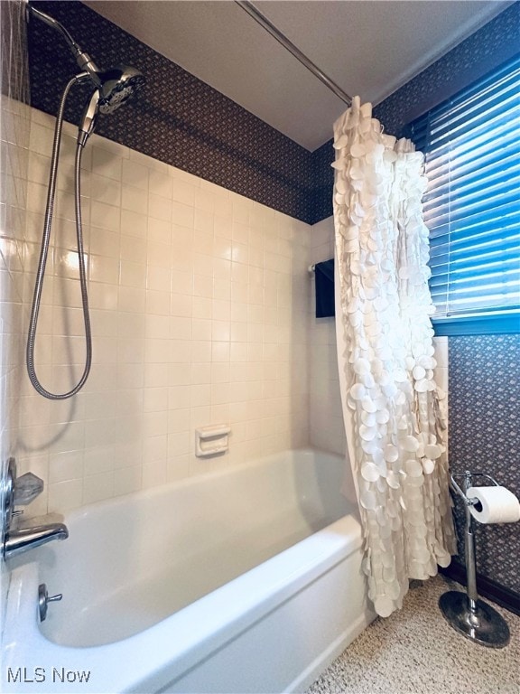 bathroom featuring shower / bathtub combination with curtain