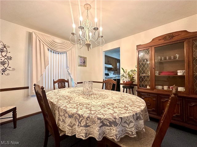 carpeted dining room with an inviting chandelier