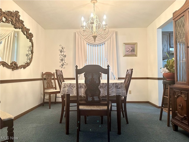 dining area featuring dark carpet and a chandelier