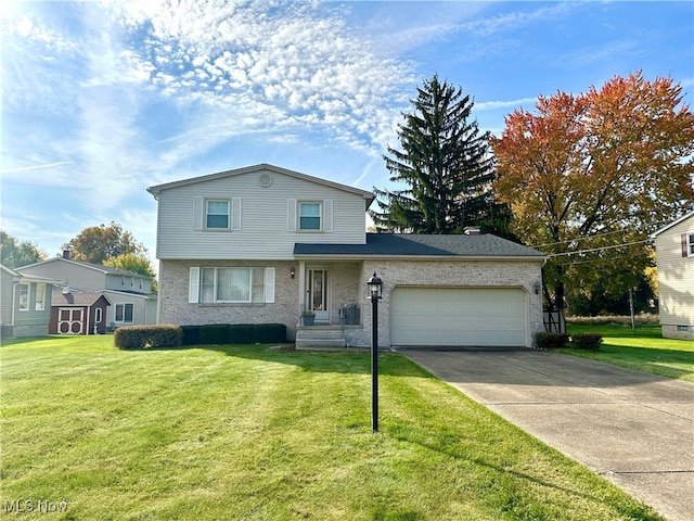 front of property featuring a front yard and a garage