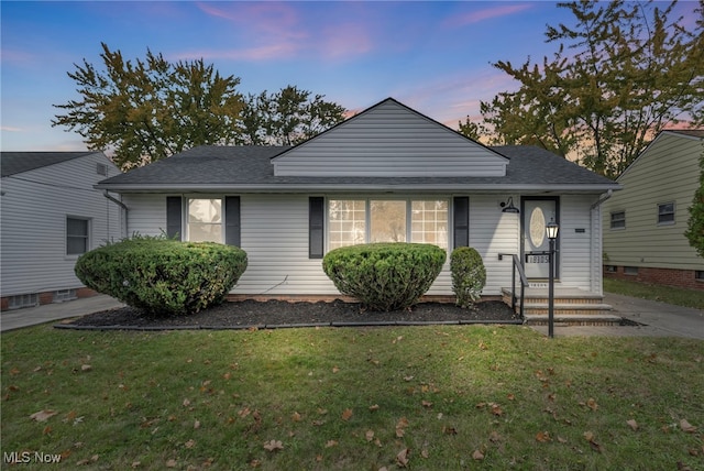 view of front of house with a lawn