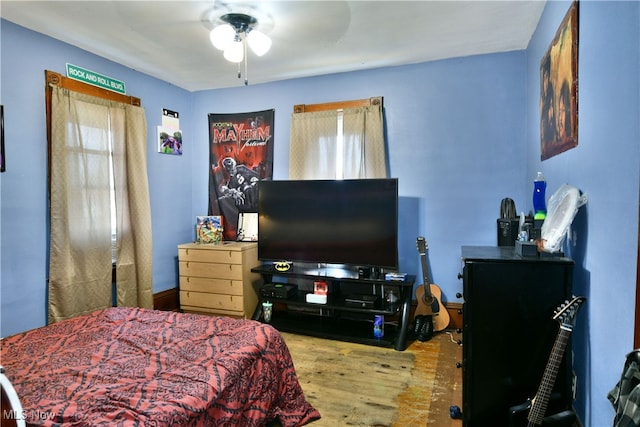 bedroom featuring light wood-type flooring and ceiling fan