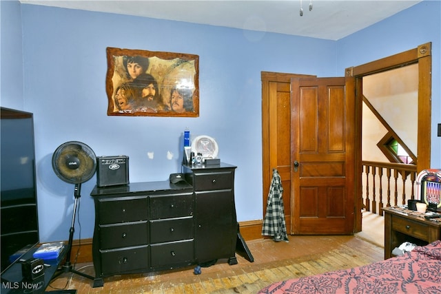 bedroom with light hardwood / wood-style floors