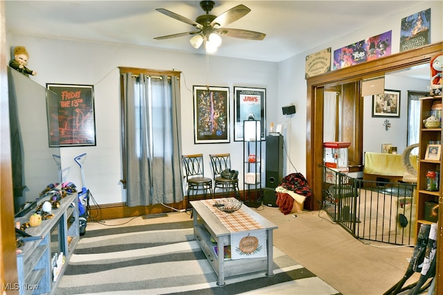 interior space with light colored carpet and ceiling fan