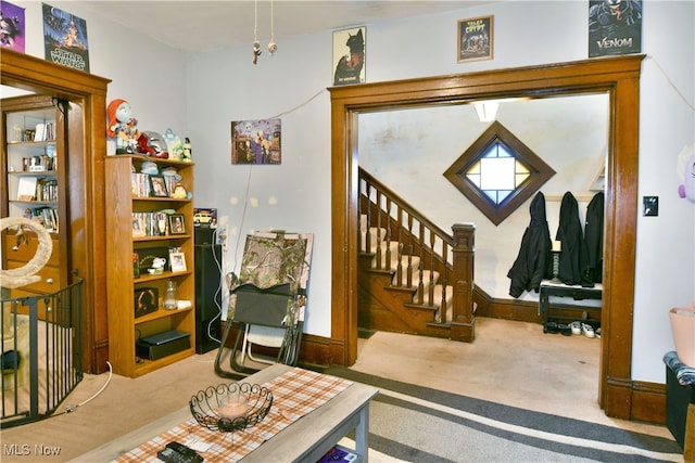 view of carpeted entrance foyer