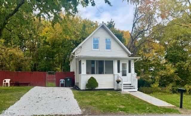 bungalow-style house with a front yard