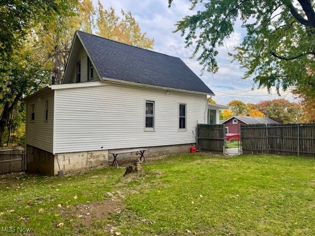 rear view of house with a lawn