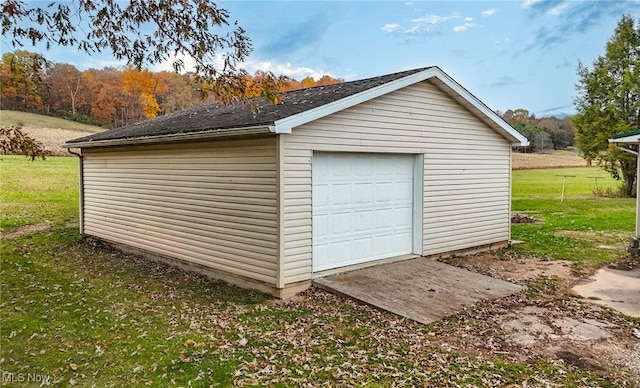 garage with a yard