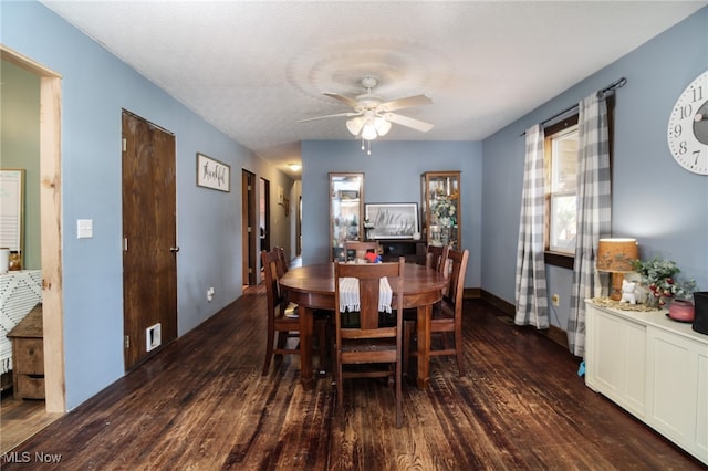 dining space featuring dark hardwood / wood-style floors and ceiling fan